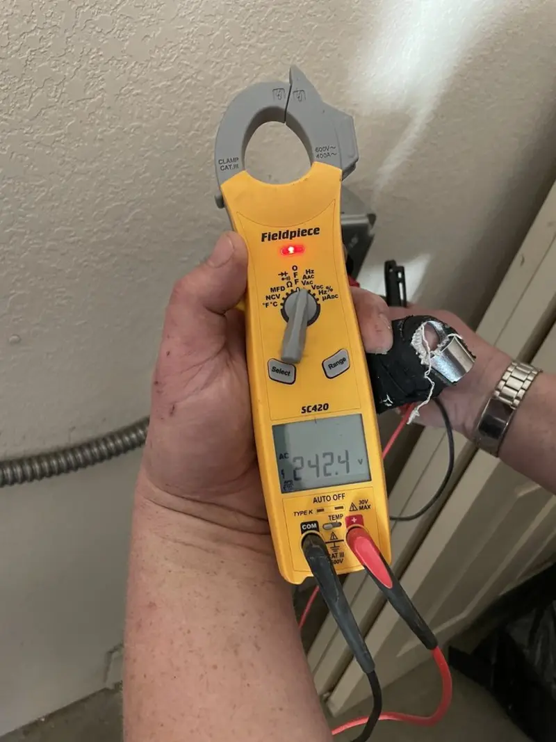 Voltage testing with clamp meter during Recessed Lighting Installation in Coventry